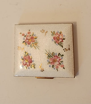 Enameled compact