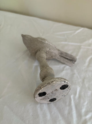 stone bird on pedestal