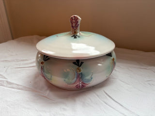 pink and green round ceramic dish with lid