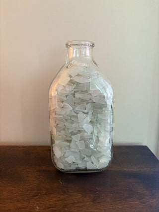 vintage Milk bottle filled with white milk glass
