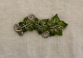 1990s fair trade enamel brooch 1”x3”