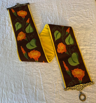 Vintage leaf wall hanging in ornate metal hanger