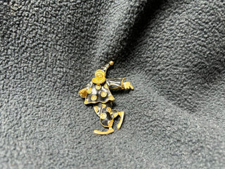 Black/gold jester pin