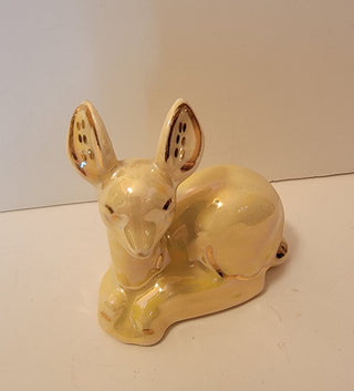 Iridescent yellow ceramic deer