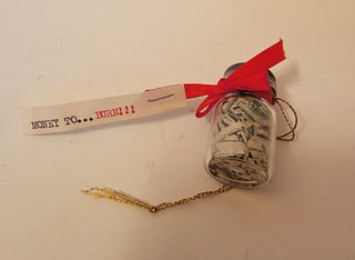 ‘Money To Burn’ mini bottle of shredded money