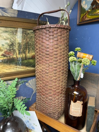 Tall round woven basket with handle