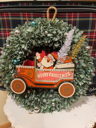 Faux wreath w/paper Santa truck
