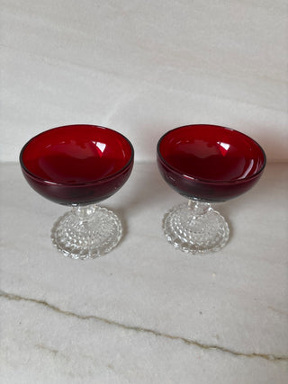 Ruby red glasses, sold as pair.