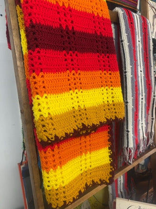 Vintage, handmade afghan blanket in retro colors.
