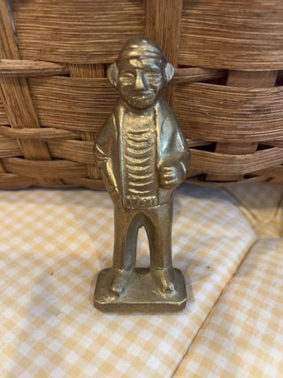 Brass fisherman figure