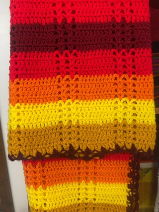 Vintage, handmade afghan blanket in retro colors.