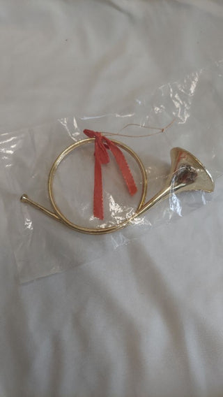 Brass tone French horn plastic ornament made in Hong Kong