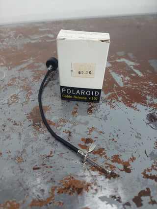 Polaroid Cable Release #191 made in Western Germany. NOS. shutter release, allowing you to trip the shutter mechanically while being isolated from the camera. As-Is