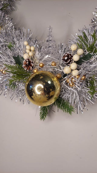 Midcentury mercury glass gold ornaments with mistletoe and pine on silver and white tinsel wreath