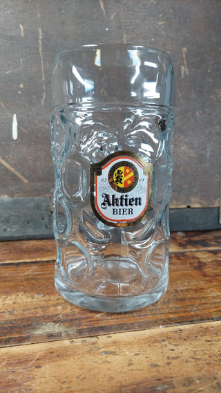 1970-80s Aktien Bier Kaufbeuren 1 Liter Dimpled German Beer Stein - Maß (1 liter) traditional Masskrug style mug - festival breweriana. Gold red white yellow black logo