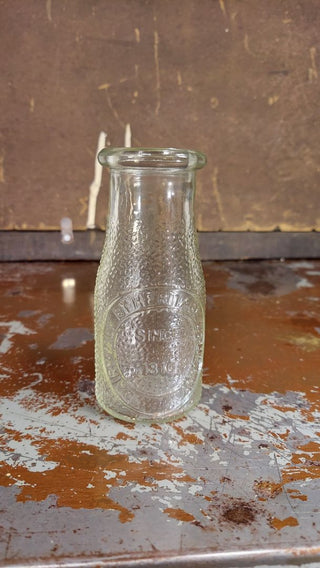 "Dairy Milk by Heritage Company - Since 1810" half pint pebble textured milk bottle