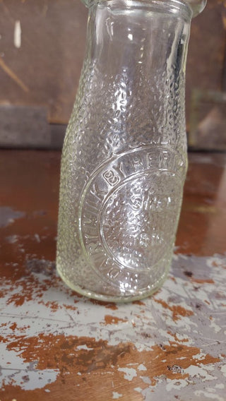 "Dairy Milk by Heritage Company - Since 1810" half pint pebble textured milk bottle