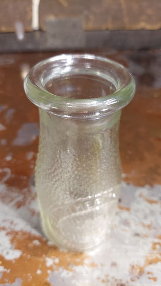 "Dairy Milk by Heritage Company - Since 1810" half pint pebble textured milk bottle