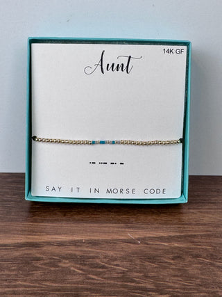 Turquoise and light gray glass bead Morse code bracelet spelling “Aunt” – JSQ Mercantile – a women’s boutique and gift shop in La Grange, IL.