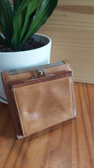 1990s Leather and canvas Wallet by Dooney and Bourke (T&M) FIRM. (Wire Cutters in 888 folder)