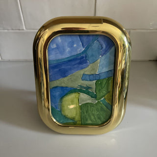 Small rounded rectangular brass frame with abstract watercolor art made in Korea