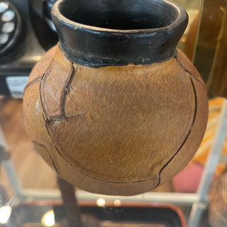 Leather wrapped pottery vessel