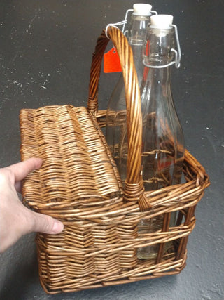Small wicker picnic basket with bottles