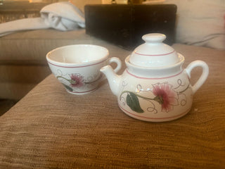 stacked teapot and cup