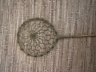 vintage brass sieve