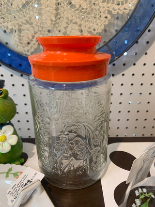 Vintage Glass storage jar w/orange lid and Lily of the Valley decor