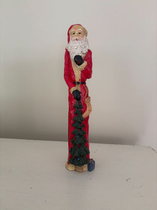 Santa statue w tree
