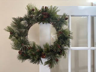 greens and pine cone wreath