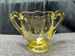 Yellow sugar bowl with flower