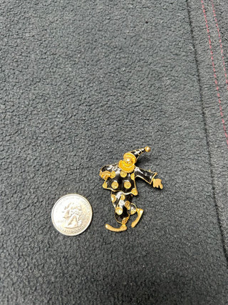 Black/gold jester pin