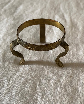 Vintage embossed metal display stand