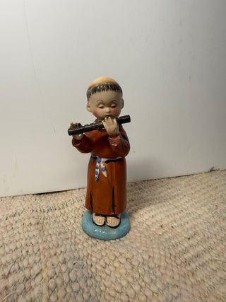 Monk playing Flute