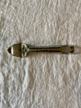 Vintage UAL metal bottle opener & can piercer