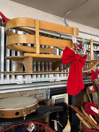 Curved Runner Sled with Red Metal Shovel Handle