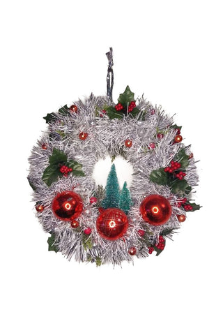 Midcentury mercury glass wreath with vintage red ornaments, mistletoe Holly Berry, bottle brush trees on silver, white tinsel