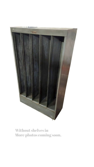 1949 pigeon hole cabinet by Neumade, with adjustable rack cubbie storage on locking casters. Vintage Midcentury film industry industrial rustic display.