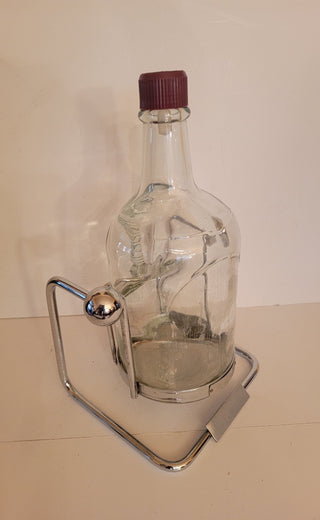 Vintage Chivas bottle in chrome cradle