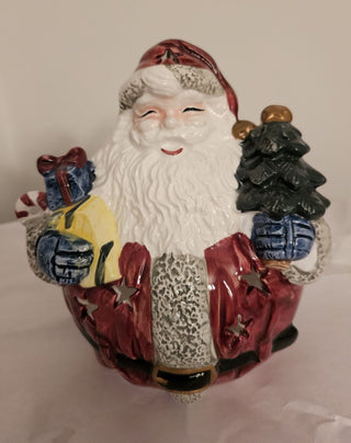 Santa Holding Toys and Tree Candle Holder