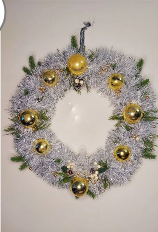 Midcentury mercury glass wreath with vintage gold ornaments, mistletoe and pine on silver, white tinsel