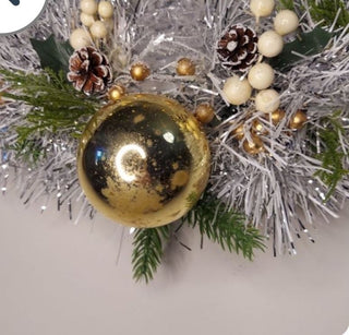Midcentury mercury glass wreath with vintage gold ornaments, mistletoe and pine on silver, white tinsel