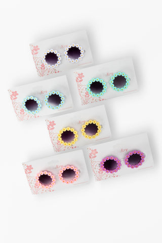 Toddler and young girls daisy sunglasses with floral frames in assorted colors, lightweight and playful design – JSQ Mercantile – a women’s boutique and gift shop in La Grange, IL.
