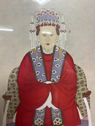 Sitting Asian woman, framed glass