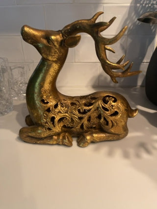 Gold seated Reindeer sculpture