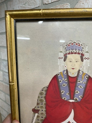 Sitting Asian woman, framed glass