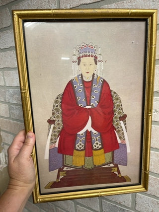 Sitting Asian woman, framed glass