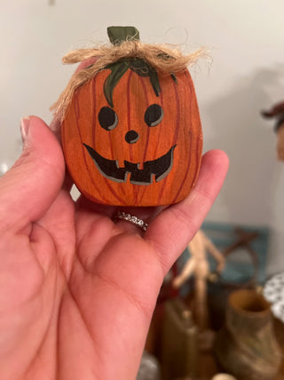 Miniature wooden jack-o’-lantern